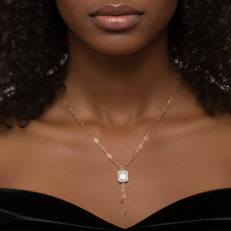 Woman wearing a Diamond necklace with a pendant against a neutral background