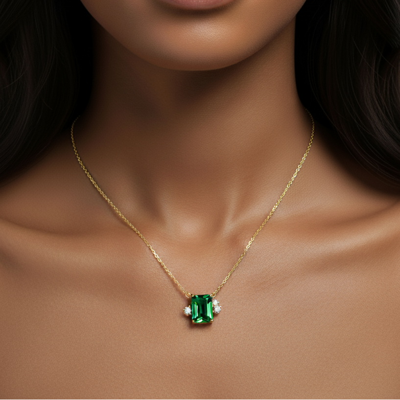 Woman wearing a Diamond necklace with a green Emraled gemstone pendant - Siran By Iram