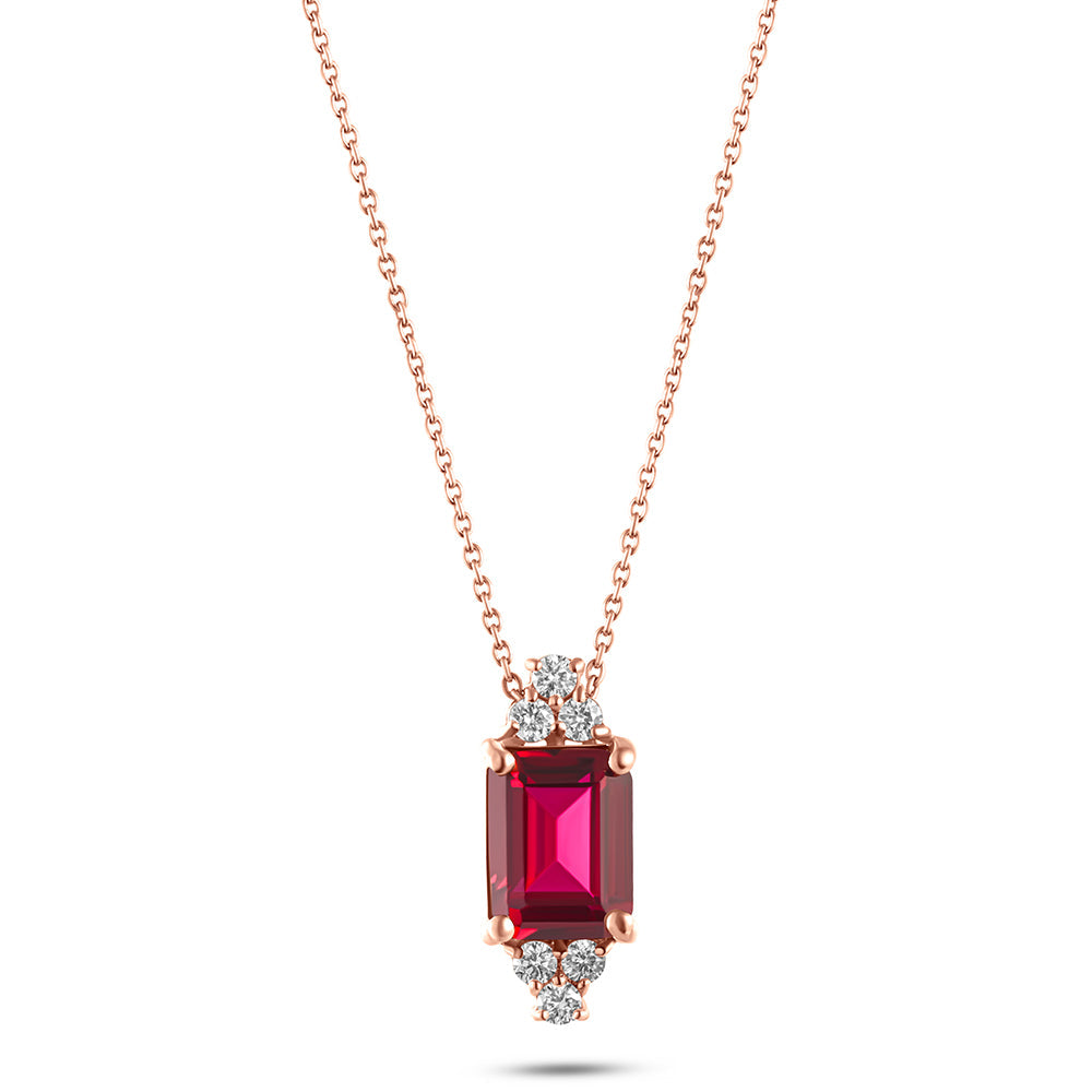 An 18K gold necklace with a central ruby stone surrounded by smaller diamond stones on a chain.