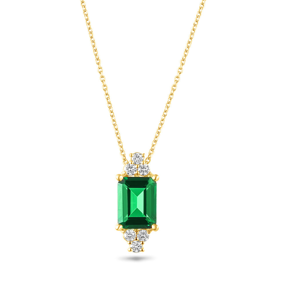 An 18K gold necklace with a central emerald-cut green stone, surrounded by smaller round diamonds on the sides, attached to a gold chain.