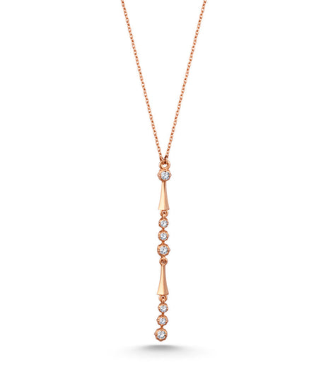 An 18K rose gold diamond necklace with a series of round diamonds set along the length of the necklace.